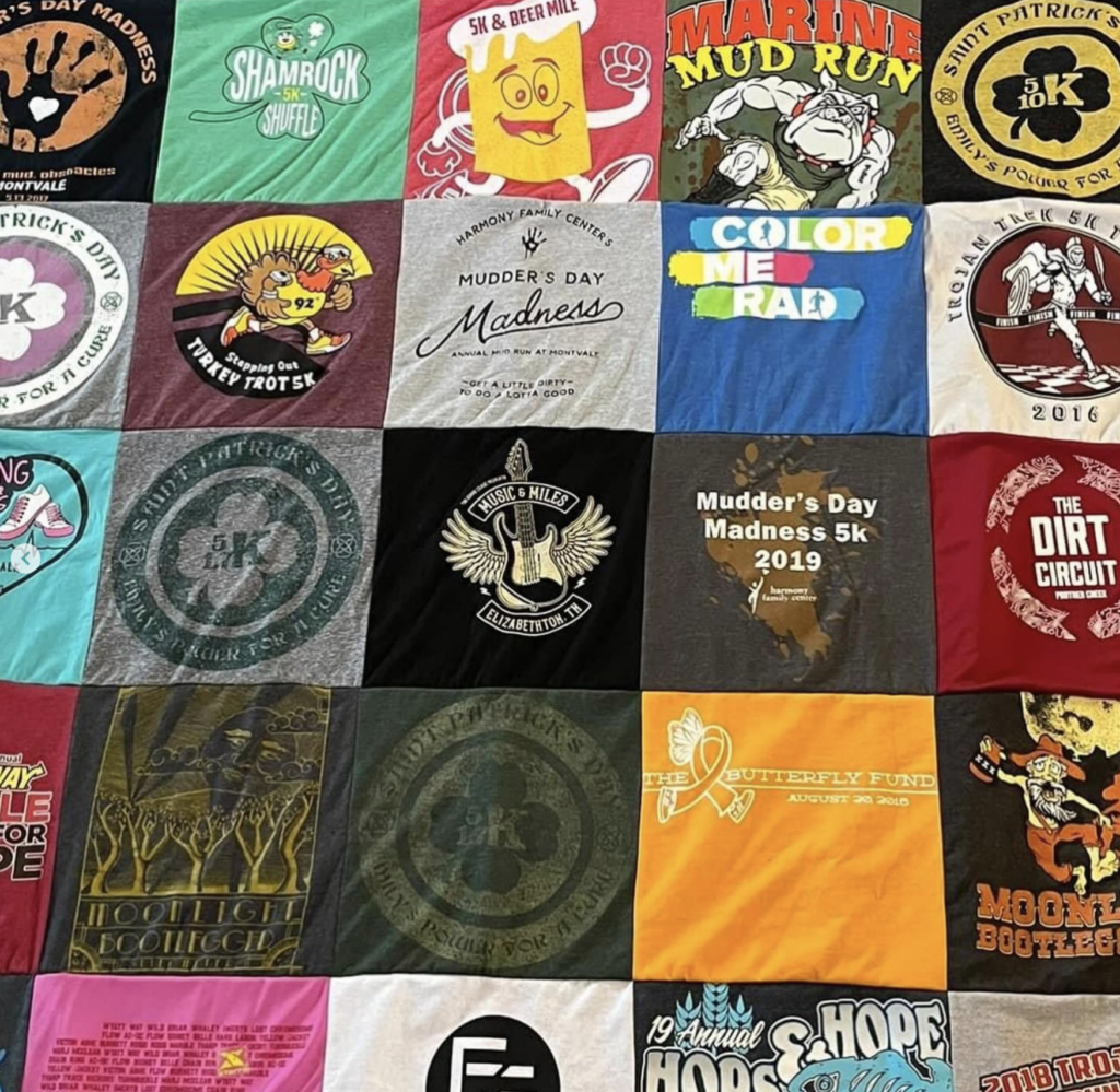 A quilt made out of upcycled shirts.